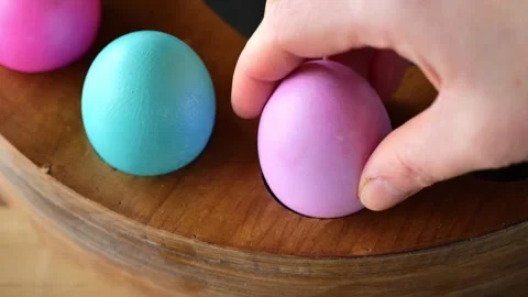 Eggs in Easter egg cup.Easter table decoration.Blue and purple easter eggs Stock Footage 296831075