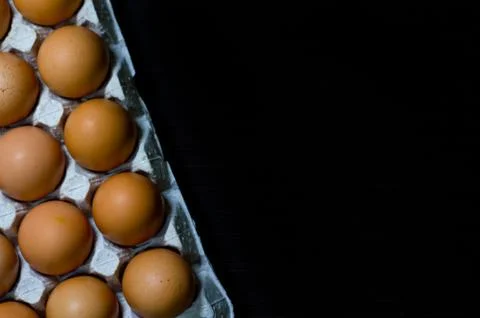Eggs egg carton box copyspace food box dark wooden board top view top Stock Photos