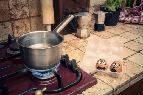 Eggs face boil scared kitchen ls Stock Photos