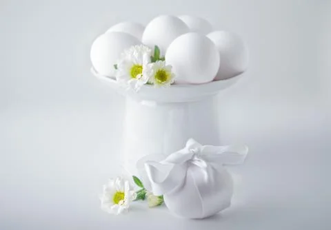Eggs with flowers on a white background. Easter Symbols Stock Photos