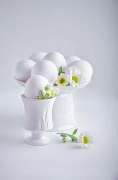 Eggs with flowers on a white background. Easter Symbols Stock Photos