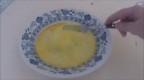 Eggs with fork beat Stock Footage 45881889
