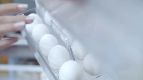 Eggs in fridge in slow motion Stock Footage 73597660