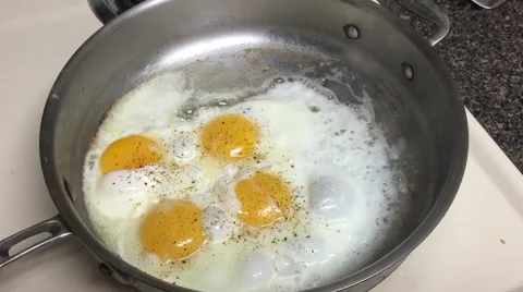 Eggs frying in a Pan Stock Footage 44265560