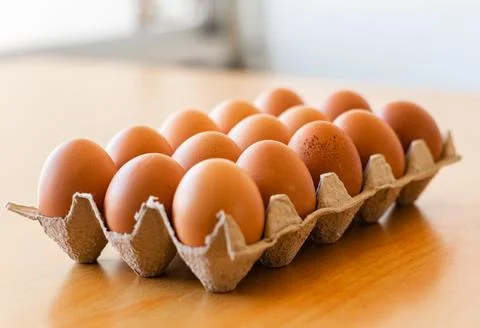 Eggs in a gray container Stock Photos