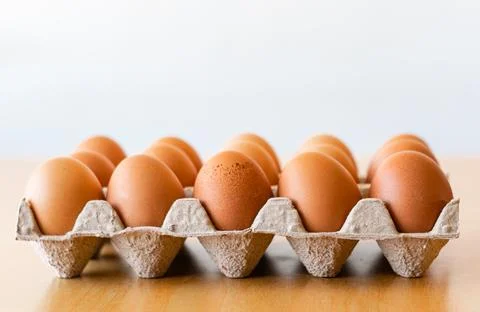 Eggs in a gray container Stock Photos