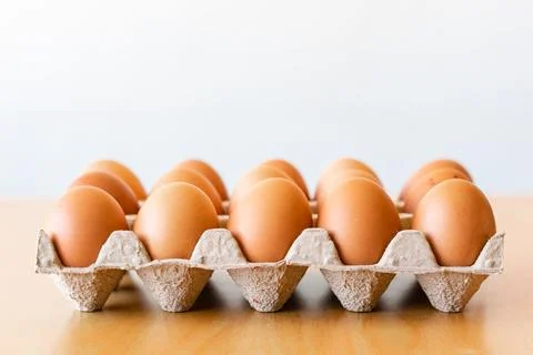 Eggs in a gray container Stock Photos