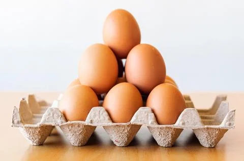 Eggs in a gray container Stock Photos