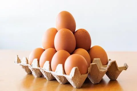 Eggs in a gray container Stock Photos