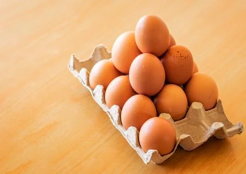 Eggs in a gray container Stock Photos