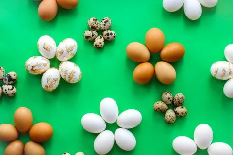Eggs on a green background. horizontal image, top view Stock Photos