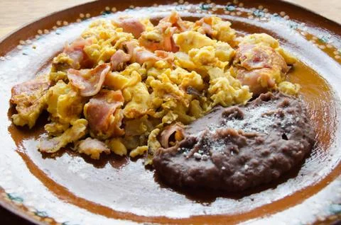 Eggs with ham and beans Stock Photos