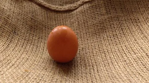 Eggs on  hemp fabric background Stock Photos