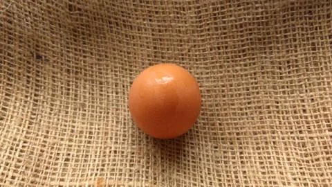 Eggs on  hemp fabric background Stock Photos