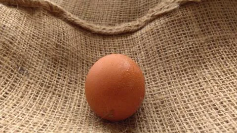 Eggs on  hemp fabric background Stock Photos
