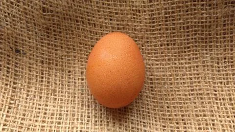 Eggs on  hemp fabric background Stock Photos