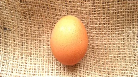 Eggs on  hemp fabric background Stock Photos