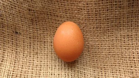Eggs on  hemp fabric background Stock Photos