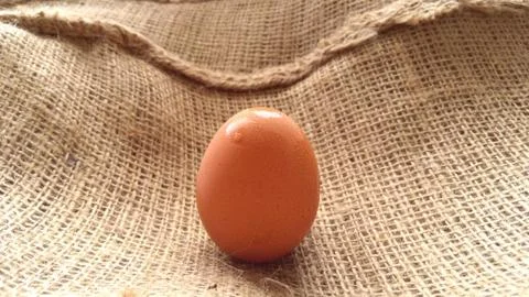 Eggs on  hemp fabric background Stock Photos