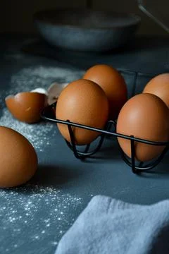 Eggs in an iron stand on a gray background Fotos Stock