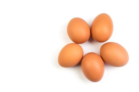 Eggs isolated on white background. Copy space for text. Top view Stock Photos