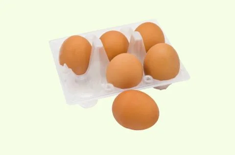 Eggs isolated on yellow background Stock Photos