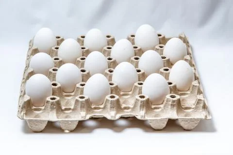 Eggs keep distance in set in cardboard box Stock Photos