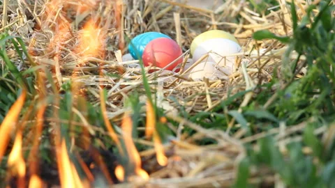 The eggs lie in the hay and the fire burns around. Easter. Celebration Stock Footage 108209599