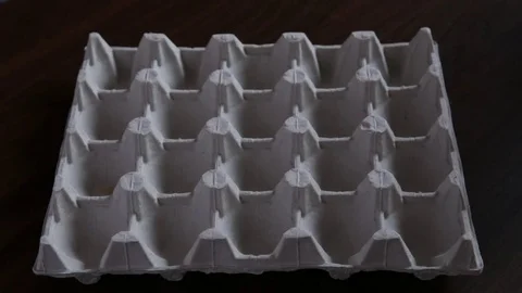 Eggs loopable animation. Appearance of eggs in egg carton Stock Footage 76574198