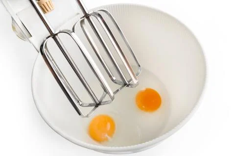 Eggs in the mixer Stock Photos