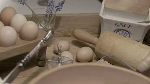 Eggs on an old baking table preparations for baking Stock Footage 234199143