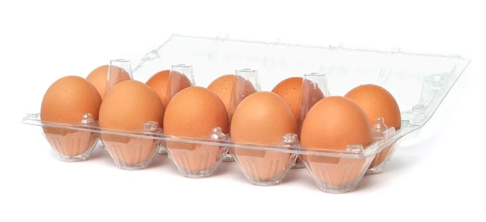 Eggs in open plastic box Foto stock