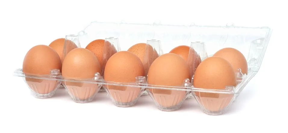 Eggs in open plastic box Foto stock