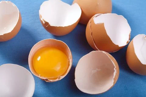 Eggs over blue Stock Photos