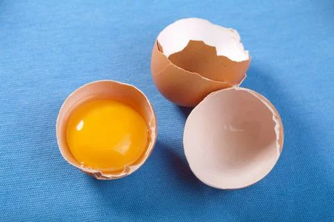 Eggs over blue Stock Photos