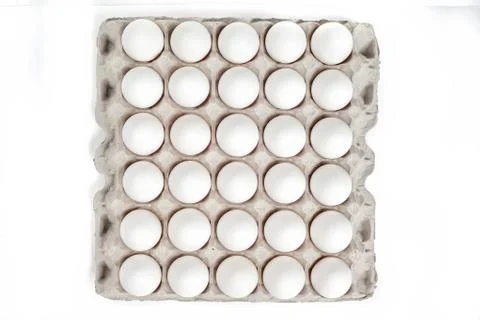 Eggs in packing on a white background Stock Photos