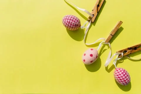 Eggs painted various patterns for Easter holiday. Yellow bright background, copy 库存照片