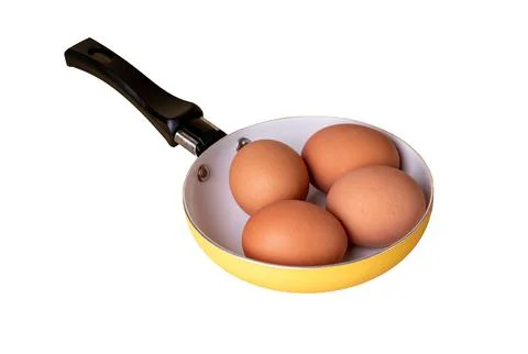 Eggs in pan isolated on white background. Easter holiday concept. Farm produc Stock Photos