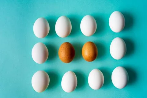 Eggs pattern over aqua pastel background. Stock Photos