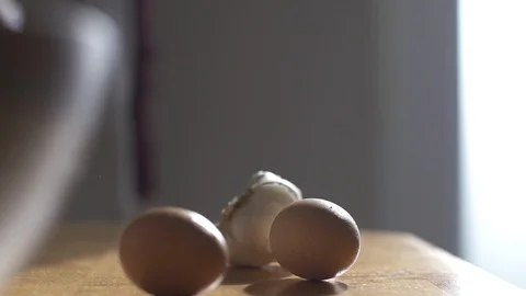 Eggs picked up off a table Stock Footage 127144098
