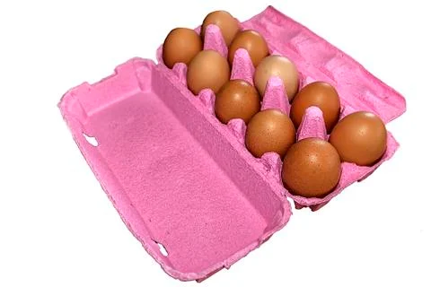 Eggs in pink packaging Stock Photos