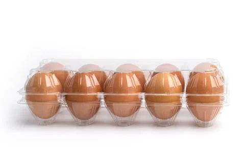 Eggs in a plastic box on the white background Foto stock