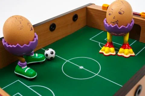 Eggs playing soccer Stock Photos