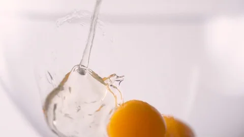Eggs put in a bowl. Slow Motion. Stock Footage 79477704