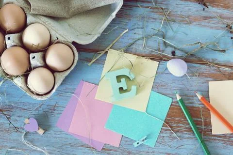 Eggs, quail, easter decor on a blue wooden table, top view Stock Photos