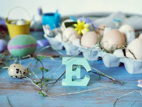 Eggs, quail, easter decor on a blue wooden table, top view Stock Photos