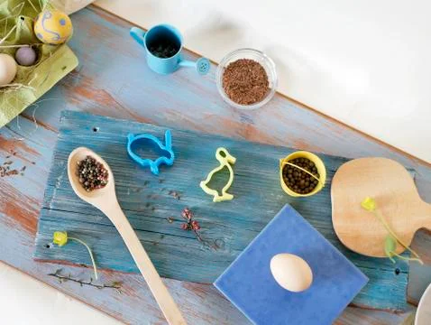 Eggs, quail, easter decor on a blue wooden table, top view Stock Photos