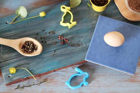 Eggs, quail, easter decor on a blue wooden table, top view Stock Photos