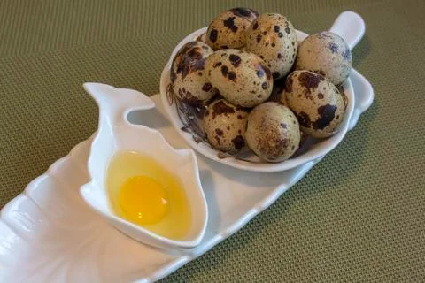 Eggs from quail - a raw and roasted. Stock Photos