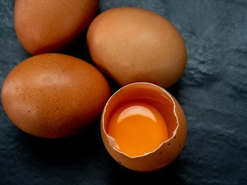 Eggs on a red background Stock Photos